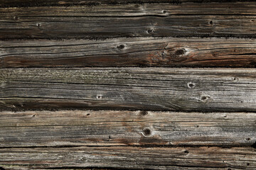 Wood texture, wooden background. Old wooden logs with cracks and scratches