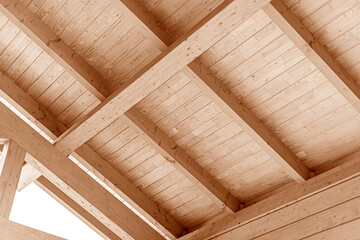 Wooden roof construction. Rafters and roof beams close-up.