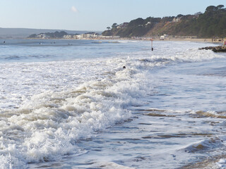 Close up of waves breaking in the sea at Bournemouth beach