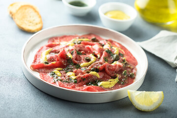 Homemade beef carpaccio with mustard sauce