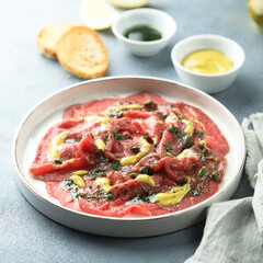 Homemade beef carpaccio with mustard sauce