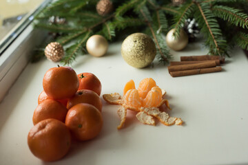 tangerines on a white background with a Christmas tree