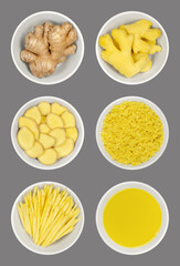 Fresh ginger root in white bowls, over gray. Whole and peeled rhizomes, slices and strips, grated and as juice. Zingiber officinale, used as spice and as folk medicine. Food photo, closeup from above.