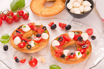 Friselle with tomatoes and mozzarella cheese.
