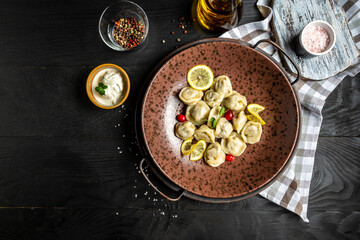 Beef and pork dumplings. Russian and Ukrainian pelmeni ravioli, dumplings with meat. banner, catering menu recipe place for text, top view