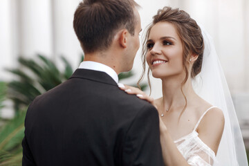 Wedding portrait of a smiling bride and groom