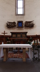Fototapeta na wymiar Religous Altar With Bible, Cross And Candles