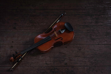 Fototapeta na wymiar Violin and bow put on wooden timber board,