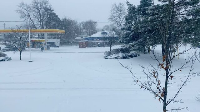 time lapse of a plow clearing parking lot after 30cm of snow in Canada