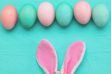 Easter decor: pastel eggs and bunny ears. Preparing for Easter. The photo