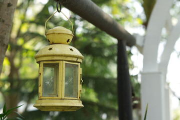 Old lanterns hanging yellow candles