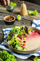 Salad with fish. Fresh green salad with smoked trout, eggs and herbs, catering, banner, menu, recipe, vertical image