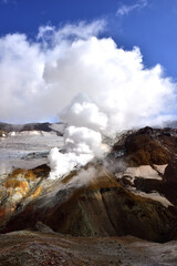 Fototapeta na wymiar Steam-gas emissions in the crater of Mutnovsky volcano in Kamchatka