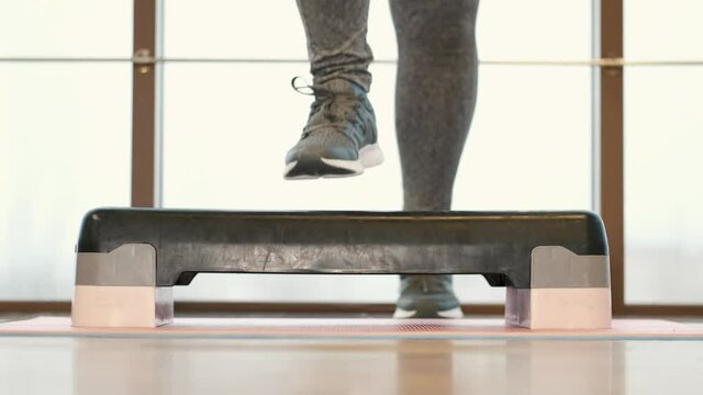 Women working out cardio and CrossFit cardio cross fit  sports working out work out gym home gym interior room design office window home furniture chair floor table empty house wall wood indo
