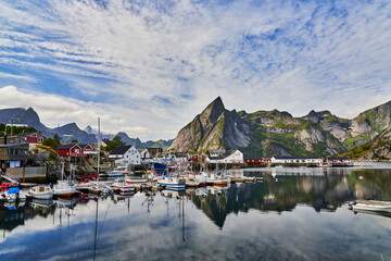 Fototapeta na wymiar Port of Reine Moskenesoy in Lofoten in Norway with various fishing boats and houses