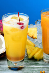 Pineapple cocktail with ice and cherry