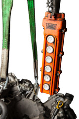 Orange control panel for a crane in an in-booster production or in a car service with buttons for...