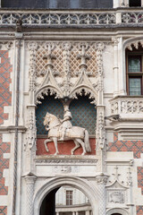 Statue of Francis I on the façade of the castle of Blois on the banks of the Loire in France