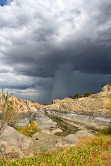 Rain shaft with storm clouds landscape - 401803915