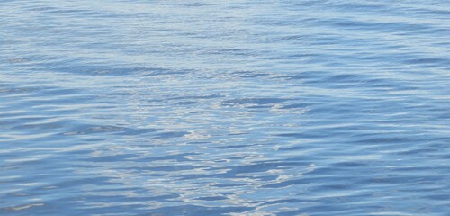 Matte light blue river water background on Florida nature