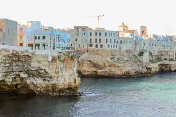 Beautiful view of the buildings on the rocks and view of the sea from Polignano a mare, province of Bari in Puglia, famous tourist destination in southern Italy.