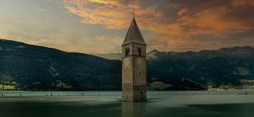 Campanile di Curon Venosta, or the bell tower of Alt-Graun, Italy. Reschensee, clock.