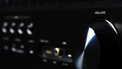 Front side of the AV receiver with volume knob close-up.