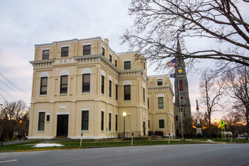 Fototapeta premium Goshen, NY - USA - Dec. 26, 2020: - landscape view of the 1887 County Building, located in the Church Park Historic District of Goshen, NY.
