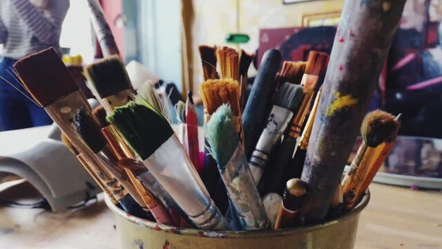 Art tools in artist studio, paint brushes and oil palette, creative hobby and artistic workspace. High quality 4k footage