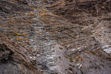 Strata of Slate is a fine-grained  homogeneous metamorphic rock derived from  shale type sedimentary rock composed of clay or volcanic ash. It is found in Himalayas in Himachal Pradesh, India.