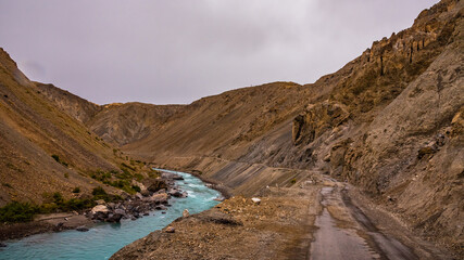 View from hilly mountain road Hindustan Tibet Road connecting Kaza city with Shimla state capital travelling through Himalayas mountains near Kalpa Kinnaur, Himachal Pradesh, India.