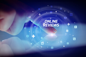 Finger touching tablet with social media icons and ONLINE REVIEWS