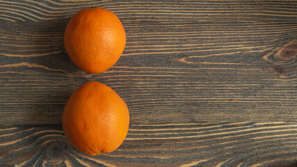 Ripe orange on wooden boards