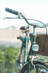 Naklejka na ściany i meble Retro bike adventure: Front picture of vintage bike, blurred background