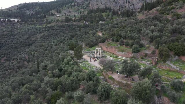 Drone video of iconic Temple of Athena Pronaia in archaeological site of Delphi, Voiotia, Greece