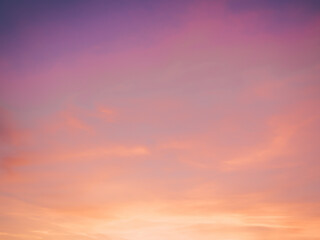 Abstract idyllic winter frosty orange and purple sky. Soft, fluffy and colorful cloud formation. Blur background texture of colorful sunset. Twilight sky. Fresh air, weather concept
