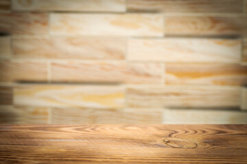 Empty rough wooden table with blurred background for product showcase with place for text or photo