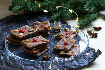 Chocolate chip cookies with almonds and cherries in the form of playing cards.