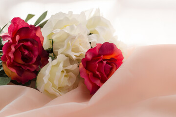 a bouquet of beautiful roses on a light delicate background