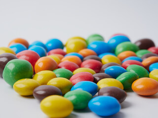 Colorful Rainbow dragee balls background. Photo Pattern design for banner, poster, flyer, card, postcard, cover, brochure. High Resolution.