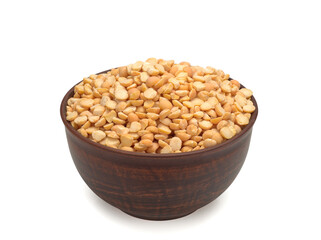 Peas, dry yellow chopped peas in a bowl, on a white background.