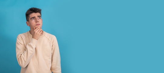 teenager with pensive expression isolated on background