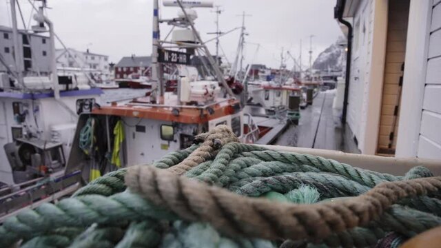 Ship anchoring marine rope at local harbor Lofoten islands Norway