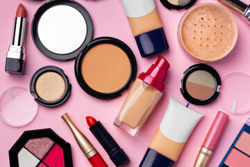 Set of decorative cosmetics on pink background