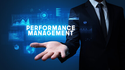 Hand of Businessman holding PERFORMANCE MANAGEMENT inscription, business success concept