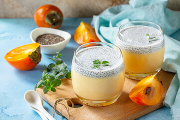 Panna Cotta with persimmon fruit and chia seeds, Italian dessert, home cooking.