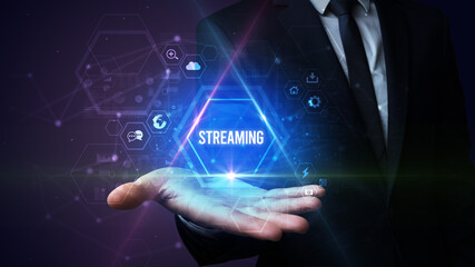 Man hand holding STREAMING inscription, social media concept