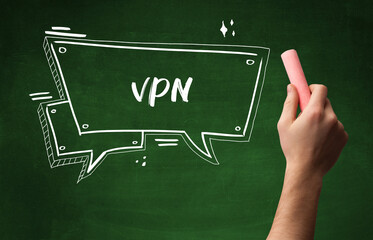 Hand drawing VPN abbreviation with white chalk on blackboard