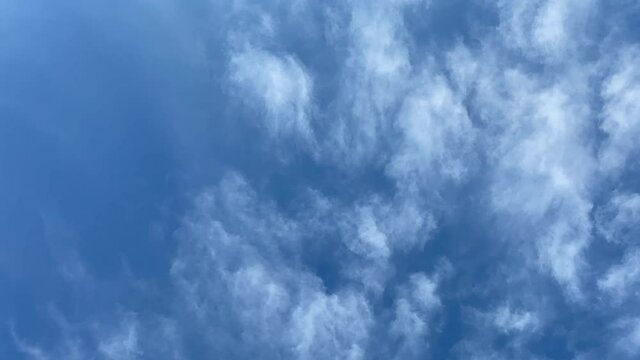 Time-lapse of a Deep Blue Sky with White Whispy Clouds