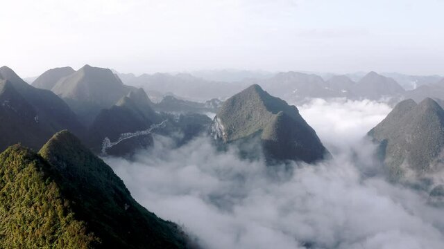 Amazing cloudy karst mountain landscape, Getu valley in China, aerial view